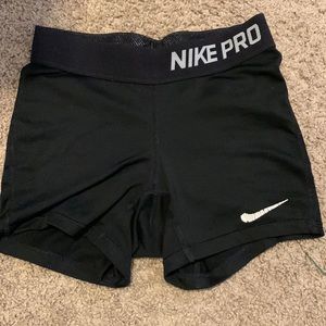 black nike pros, size small